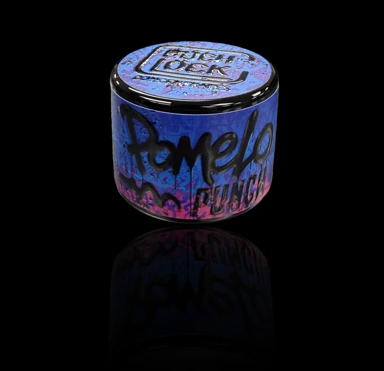 Pomelo Punch live rosin in a Couchlock tin